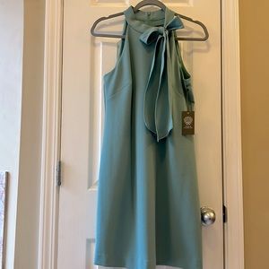 Green Vince Camuto sleevless dress. High neck with Bow. Fully lined. New w/Tag